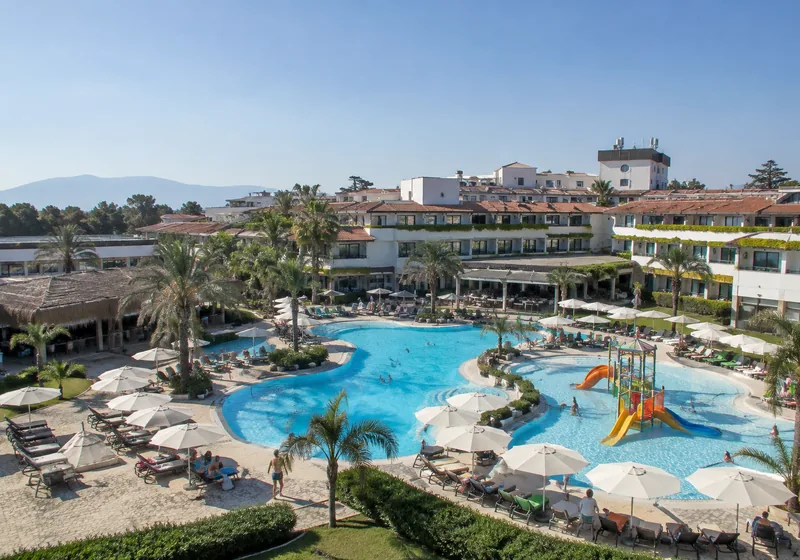 A hotel with a pool and a lounge area